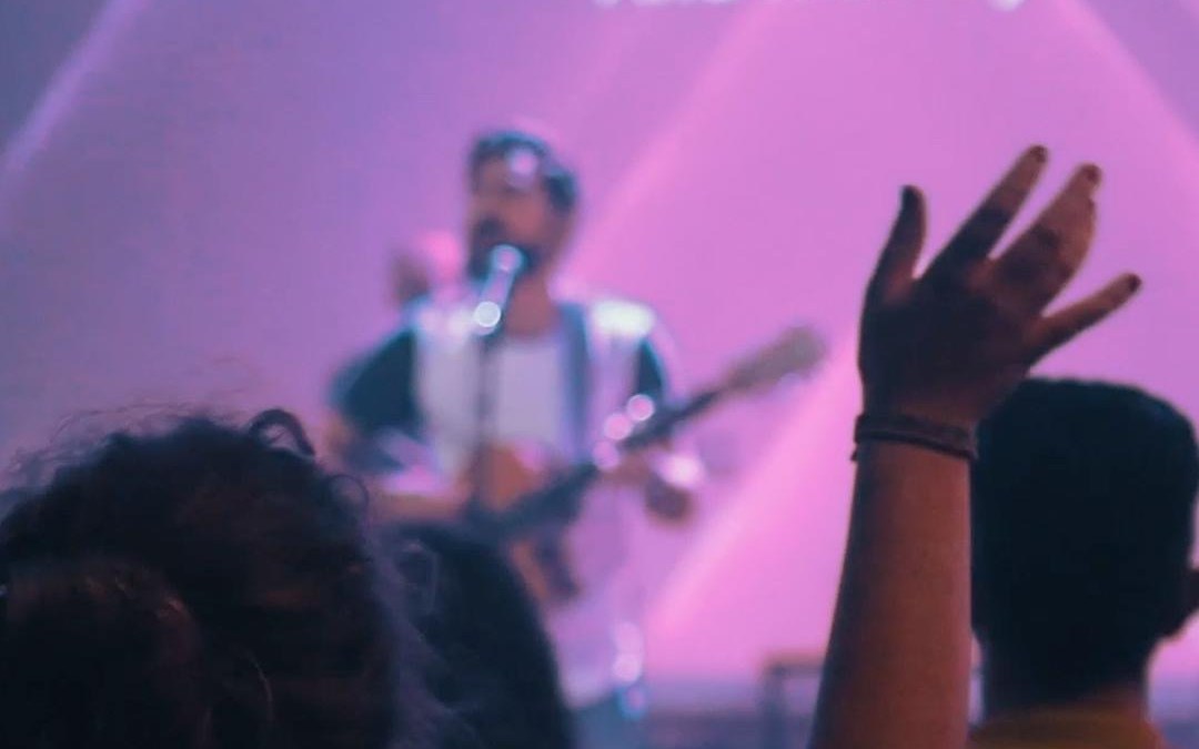 Hands raised in worship during a gathering at Resurrection Church Beirut